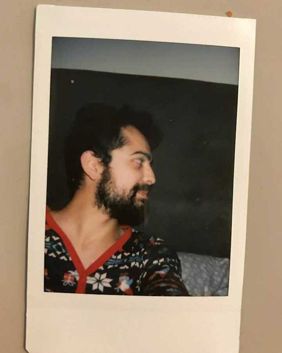 Polaroid of man taking selfie looking to his side