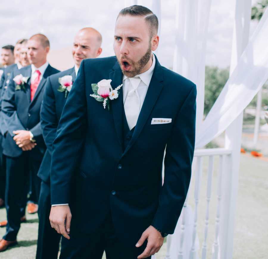 groom with jaw dropped at wedding