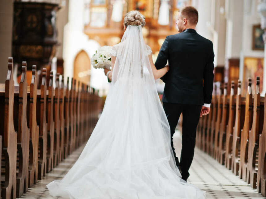 bride walking down aisle in church