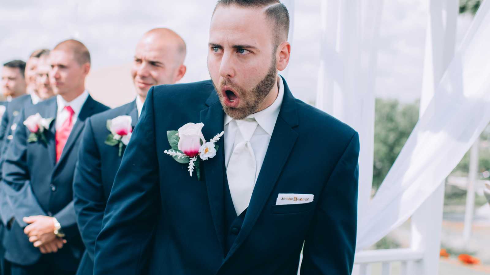 groom at wedding with jaw dropped
