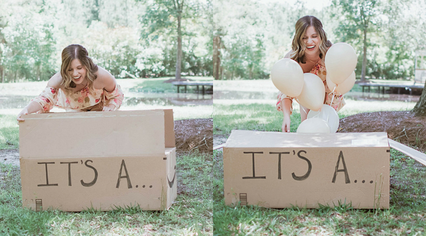wife stands in front of box saying "it's a" for surprise puppy reveal