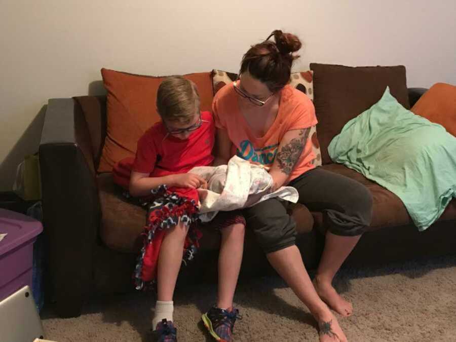 Mom lets her son hold newborn to say goodbye to him