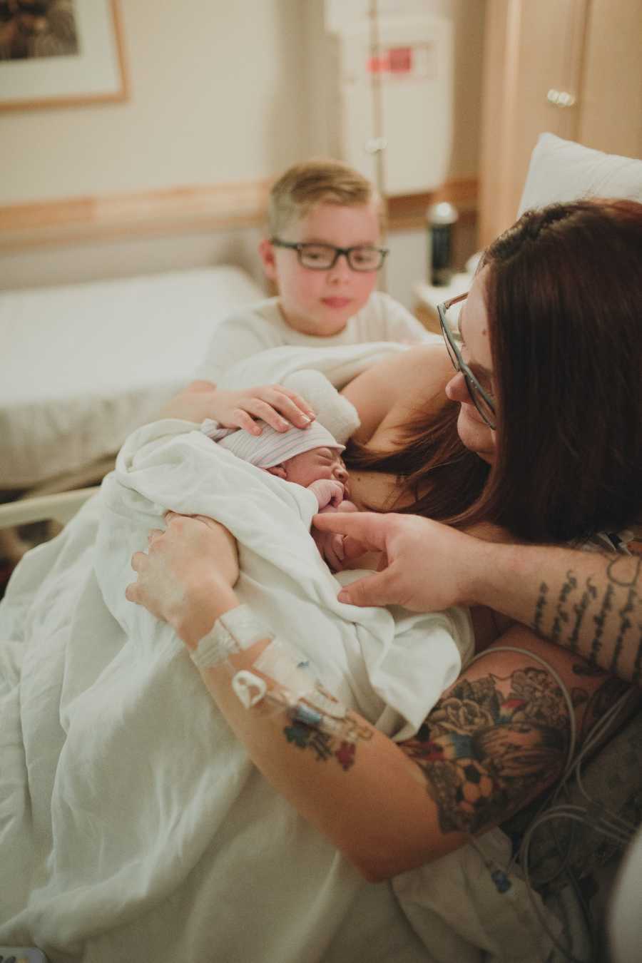 Mom does skin to skin with her newborn son after delivery