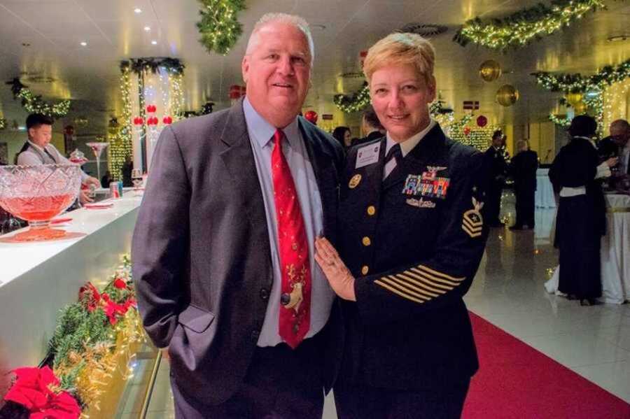 Woman in Navy uniform is joined with her firefighters husband