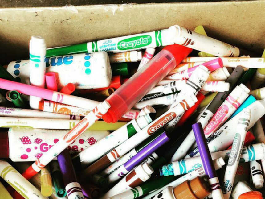 box full of used markers to be recycled by Crayola