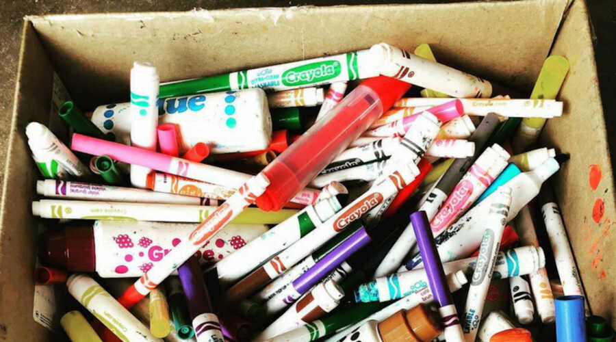 box full of used markers to be recycled by Crayola