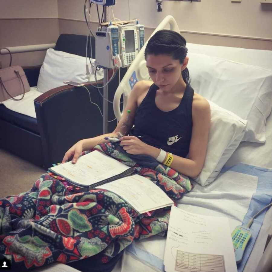 Med student in bed recovering after surgery studying to be a doctor