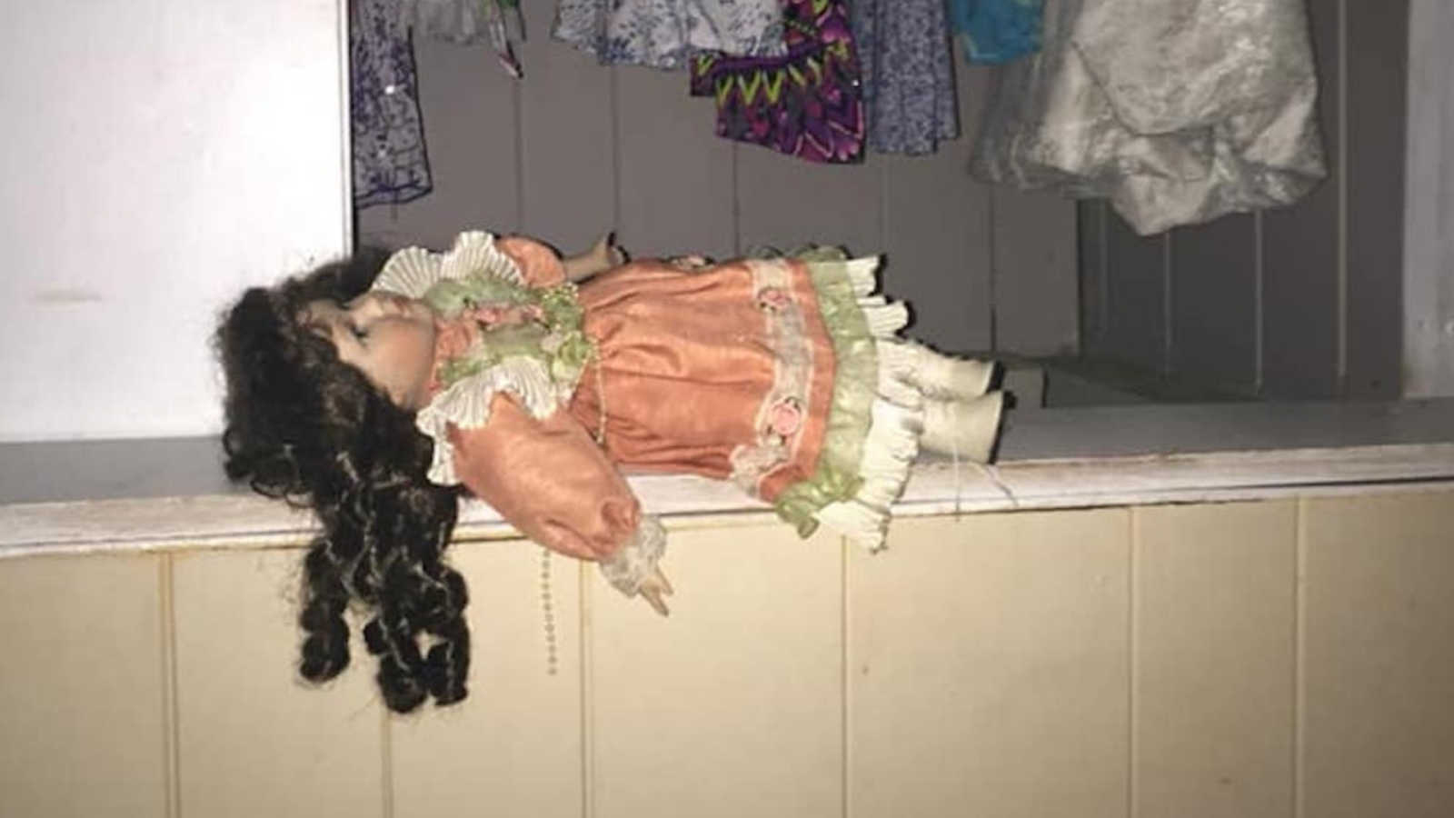 creepy doll in hallway