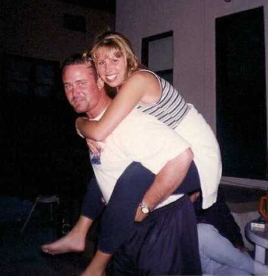 Wife piggyback riding on husband