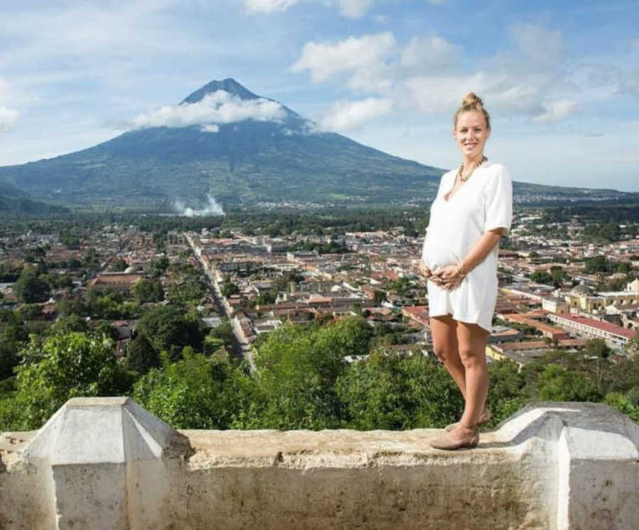 pregnant woman in front of mountain