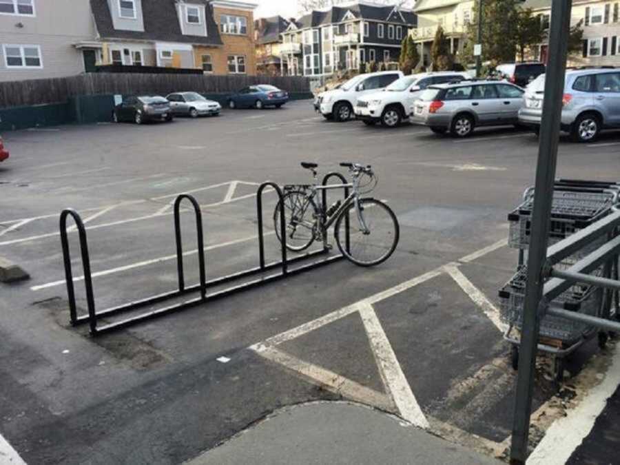 Bicycle chained in Starbucks parking lot