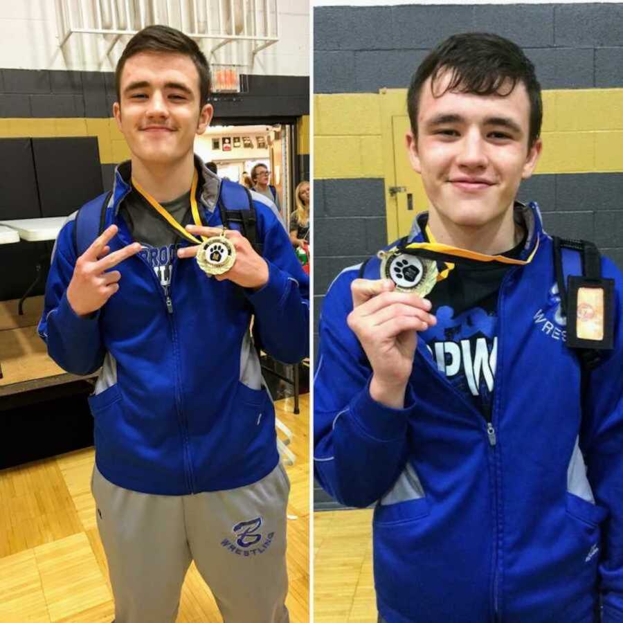 high school boy stands while holding sports medals