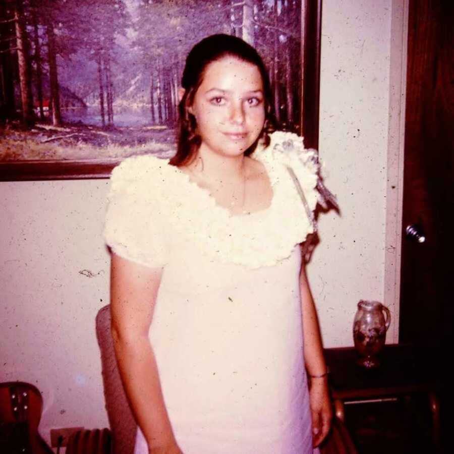 Vintage photo of teen girl wearing white dress