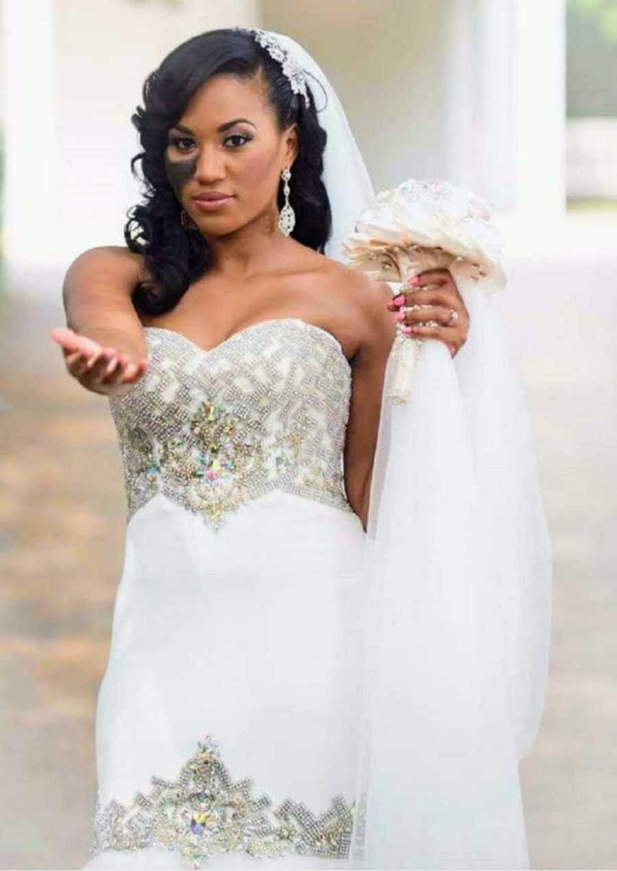 Bride holding white bouquet of flowers