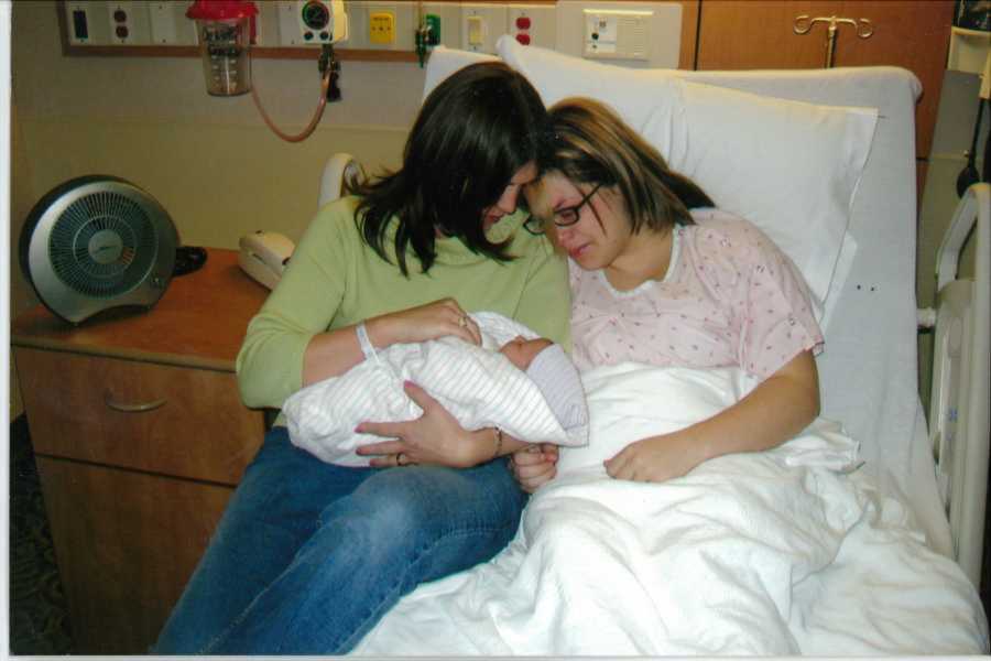 birth mom being introduced to her birth daughter by the adoptive mother