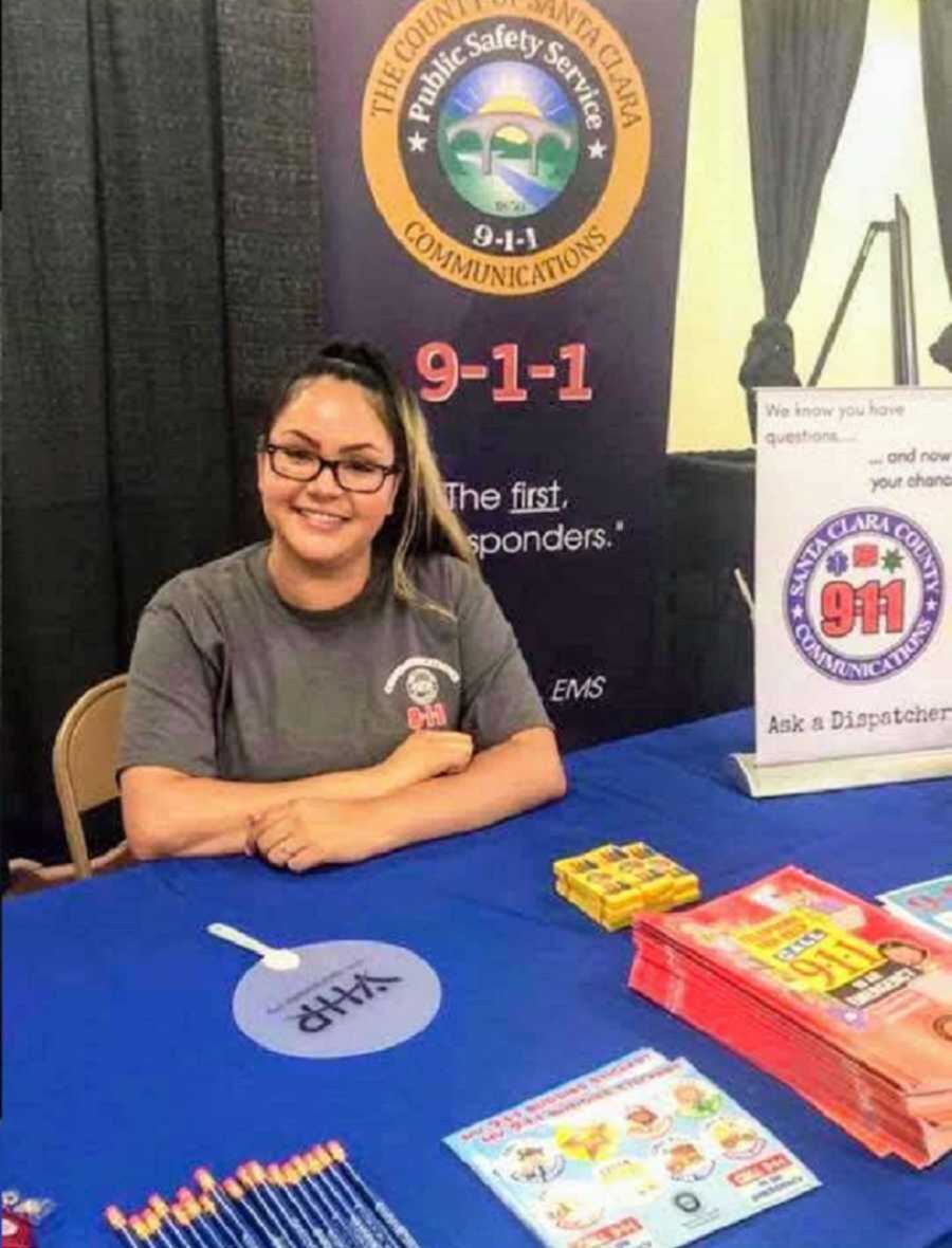 911 dispatcher sitting at table