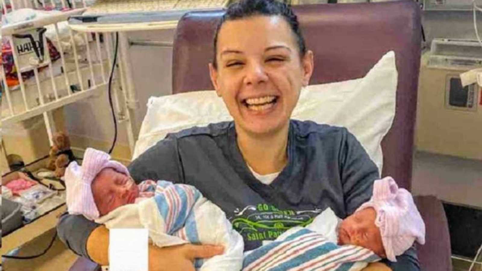 mom holding twin girls in hospital