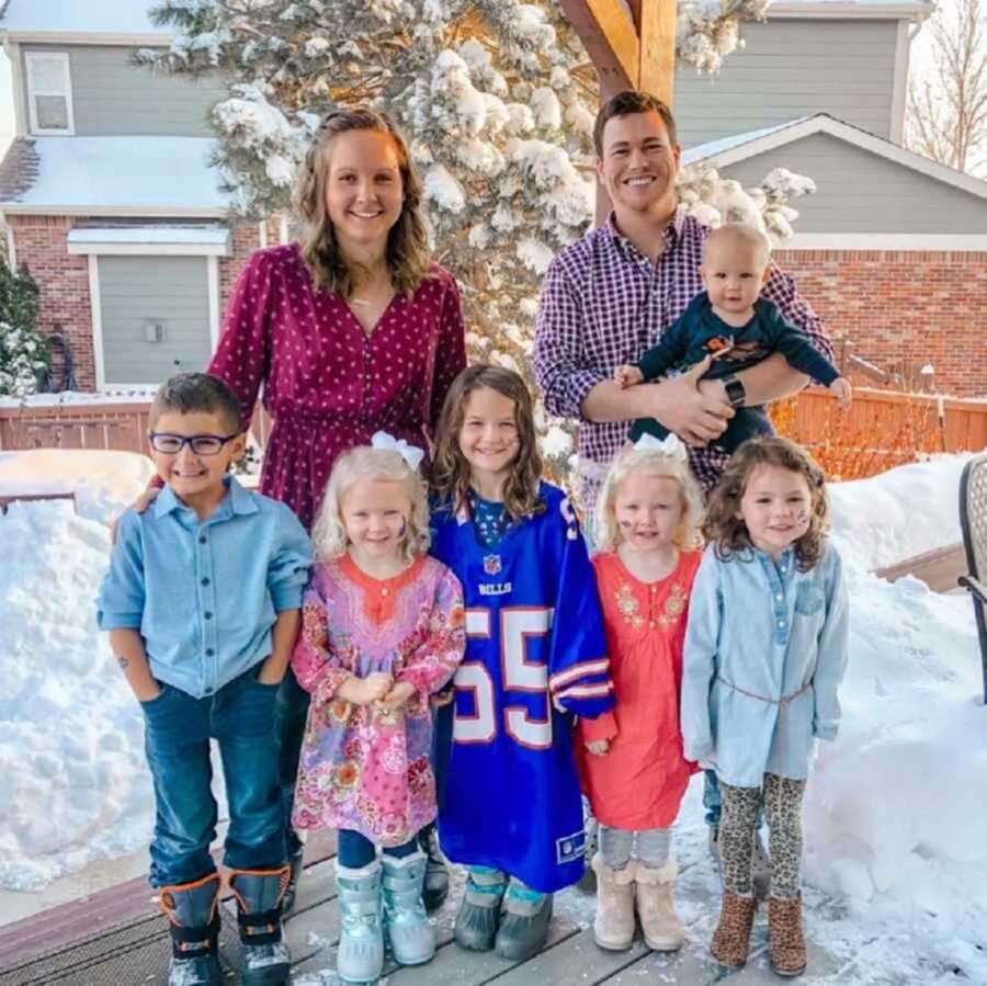 parents standing with six children