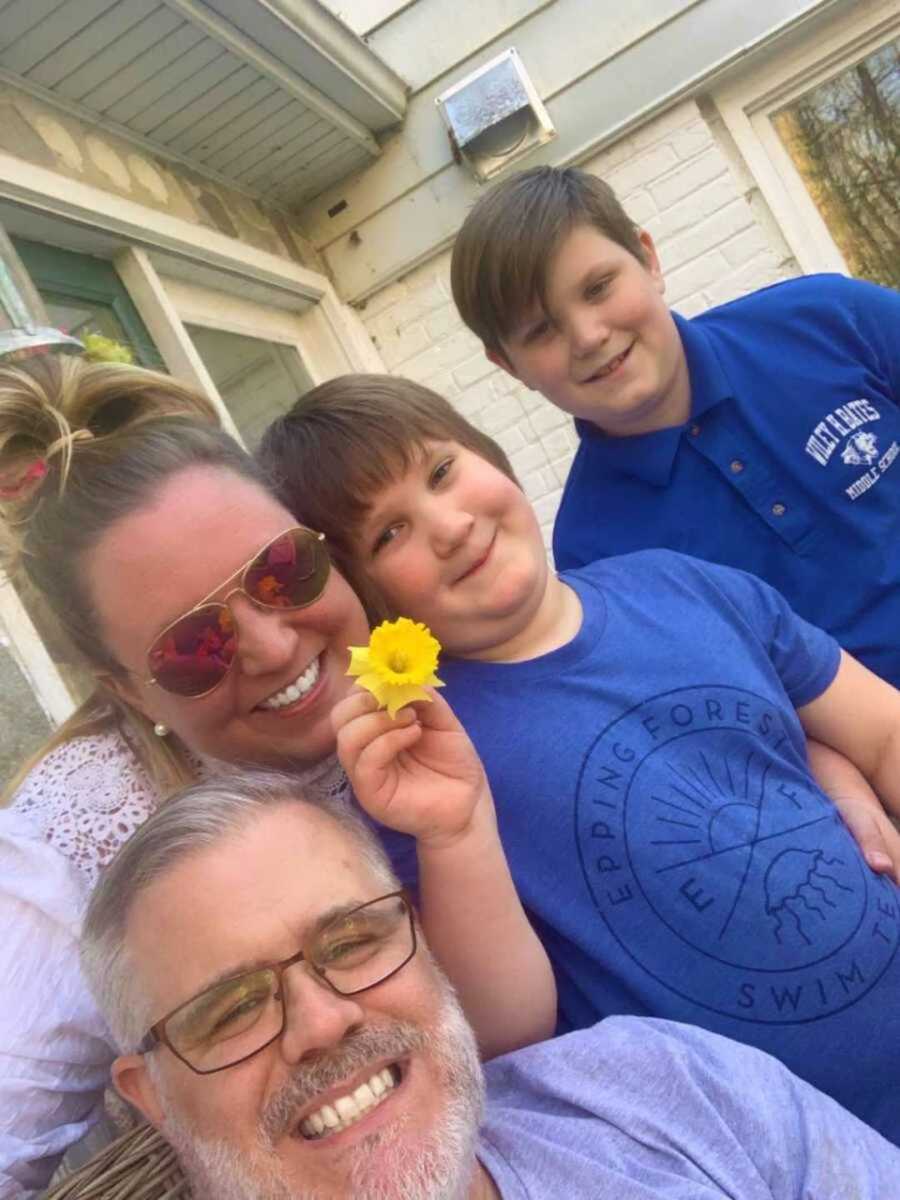 parents smiling with two children