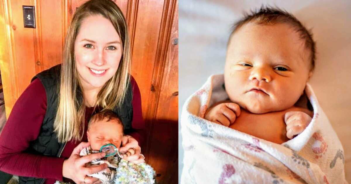 mom holding baby with Down syndrome