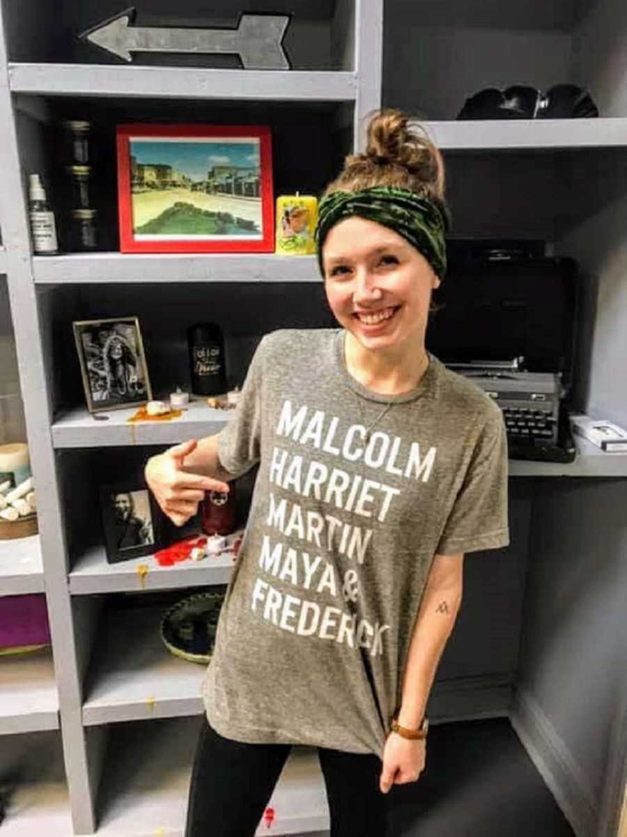 white woman celebrating Black History Month wearing a t-shirt to celebrate