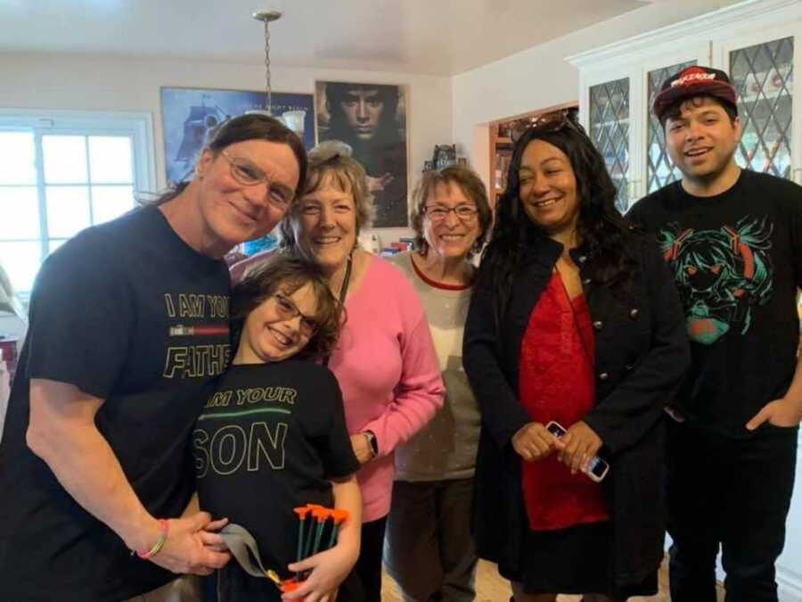 Family smiling in living room