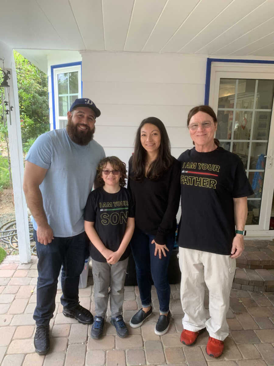 Family smiling on porch