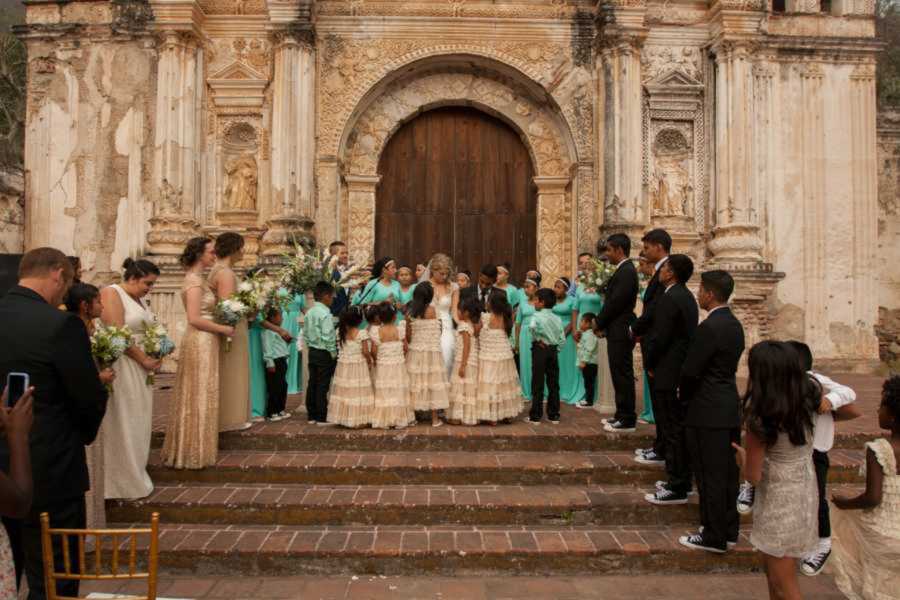 Foster kids standing at altar during Guatemalan wedding ceremony