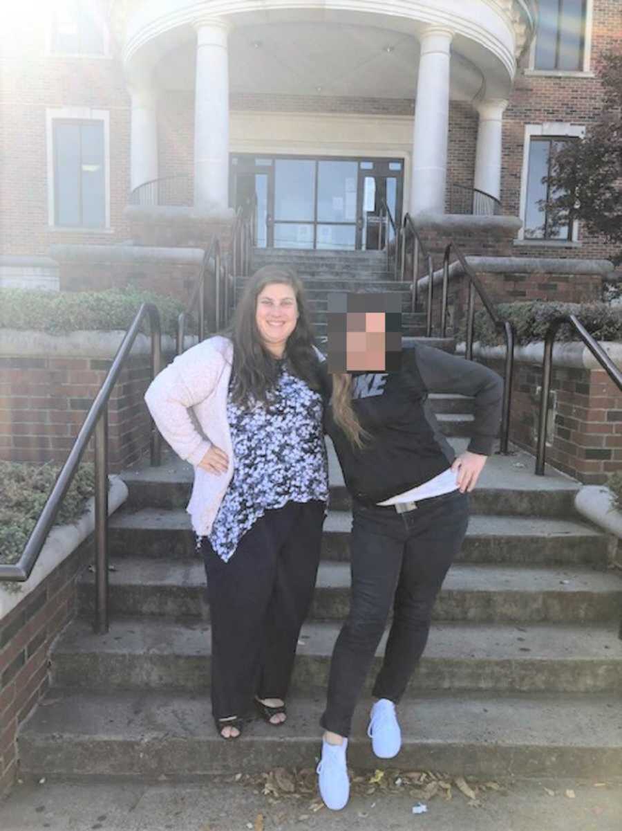 Foster mom and biological mom smiling on court steps