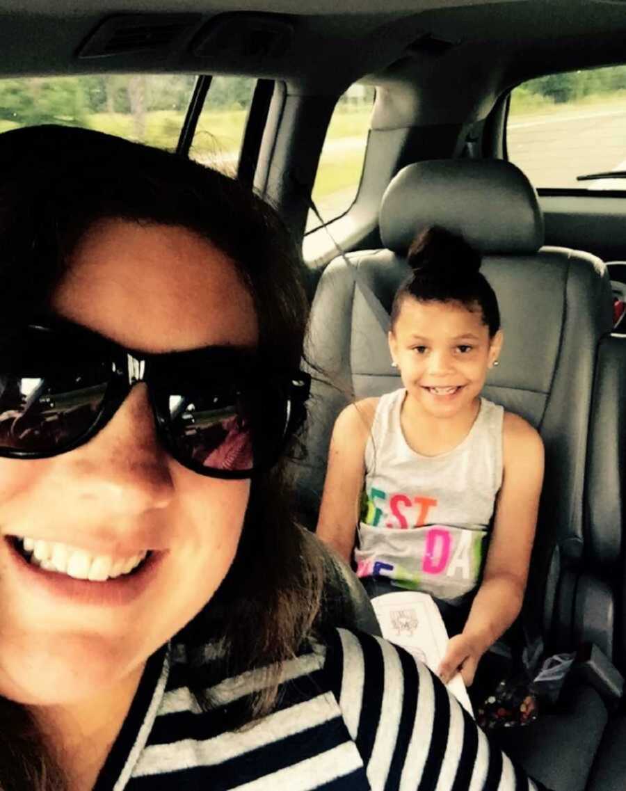 Foster mom taking selfie in car with foster daughter