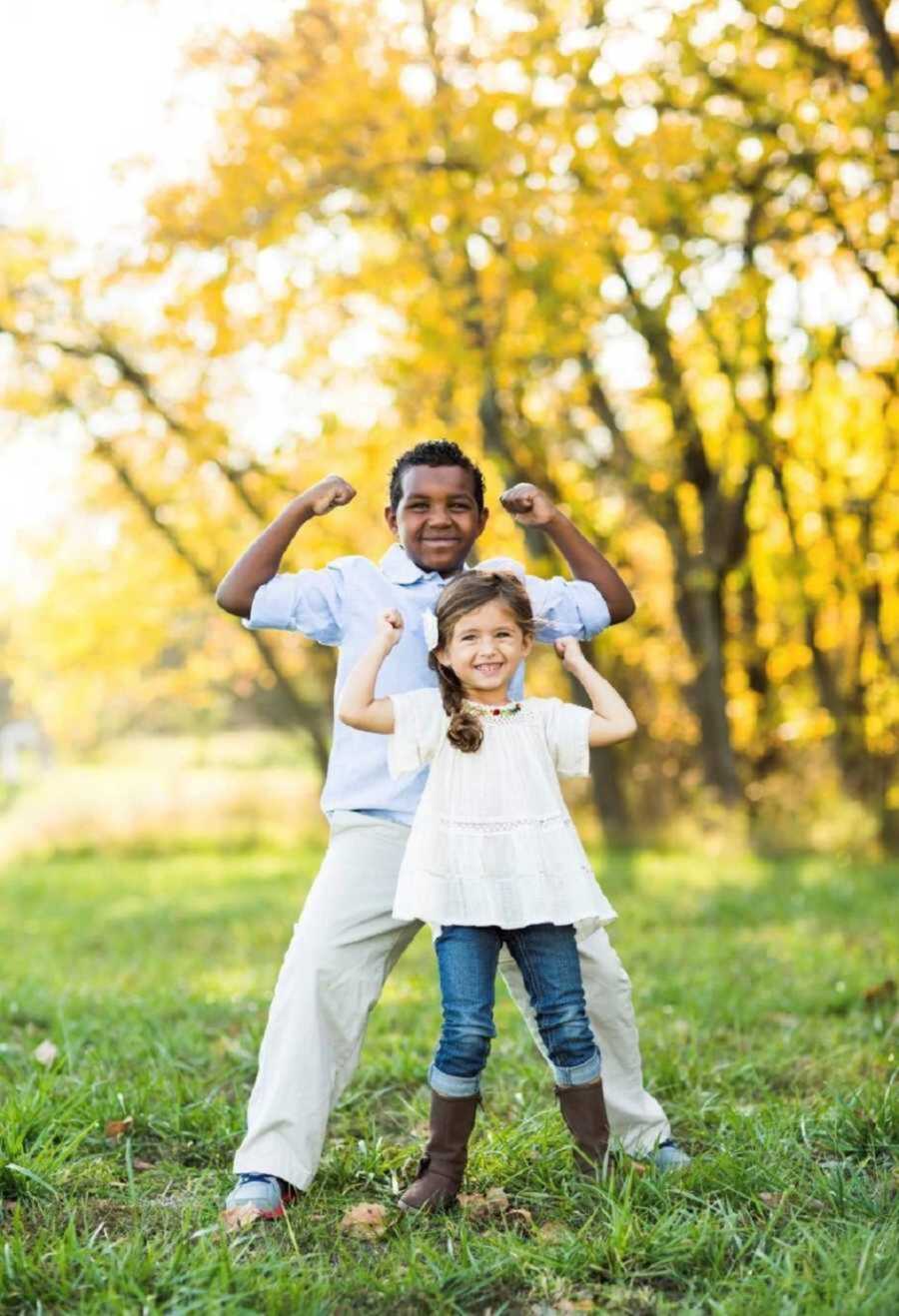 Smiling Adoptive Brother And Biological Sister Posing Together