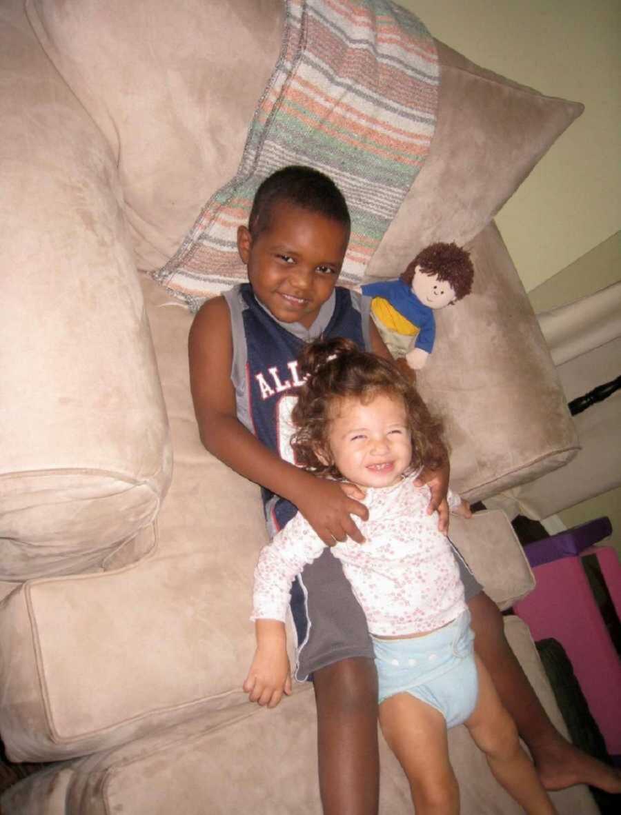 Adoptive Brother And Biological Sister Laying Together On Loveseat