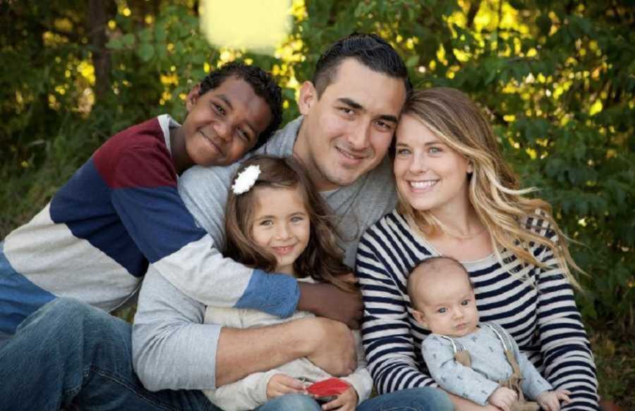 Joyful Mom And Dad With Biological And Adopted Son