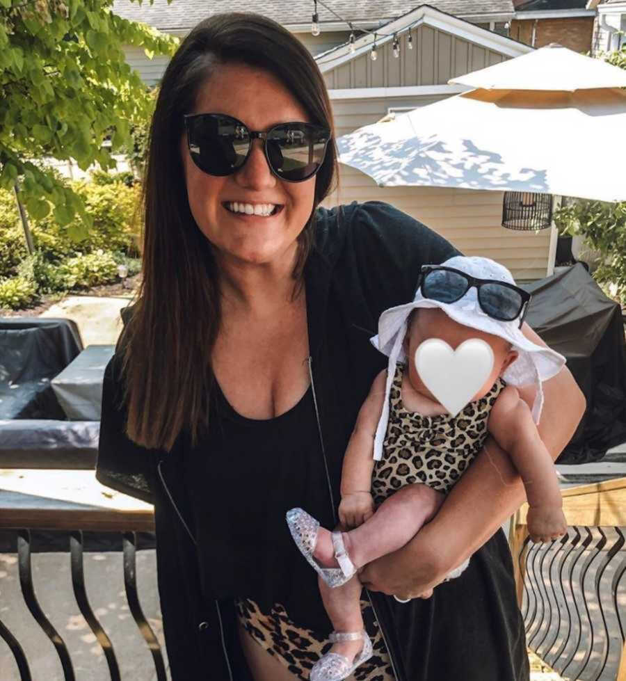 Foster mom and newborn girl wearing black sunglasses