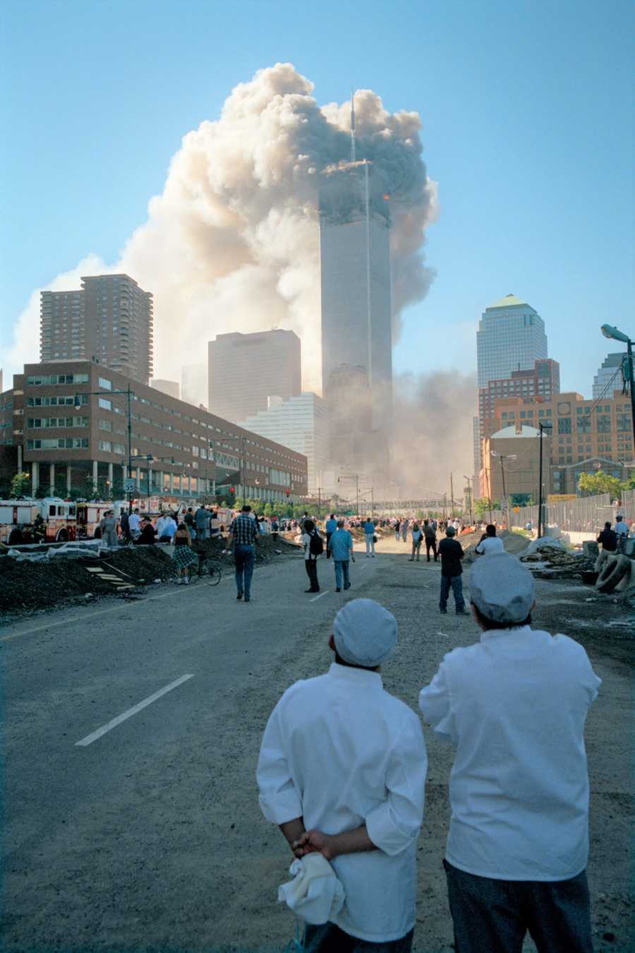 Two restaraunt workers watch the towers as they are crashed into