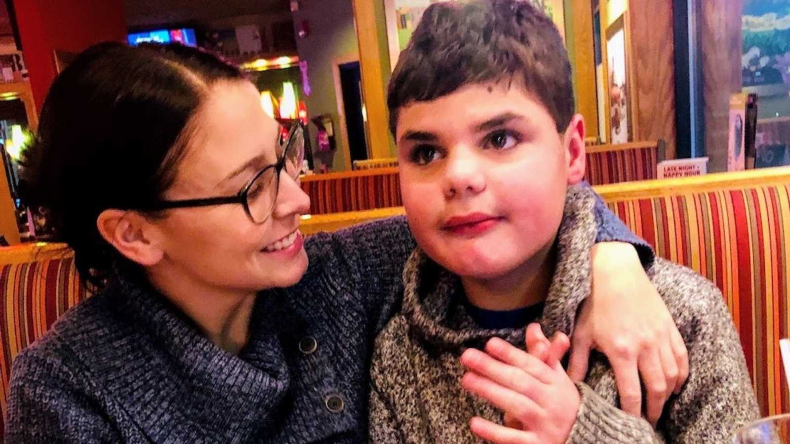 Mom holds son with autism in Beef Barn restaurant