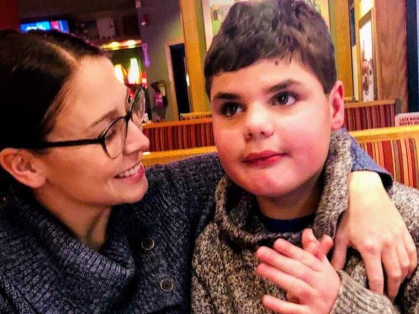 Mom holds son with autism in Beef Barn restaurant