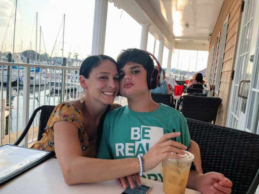 Special needs mom and son sitting at restaurant
