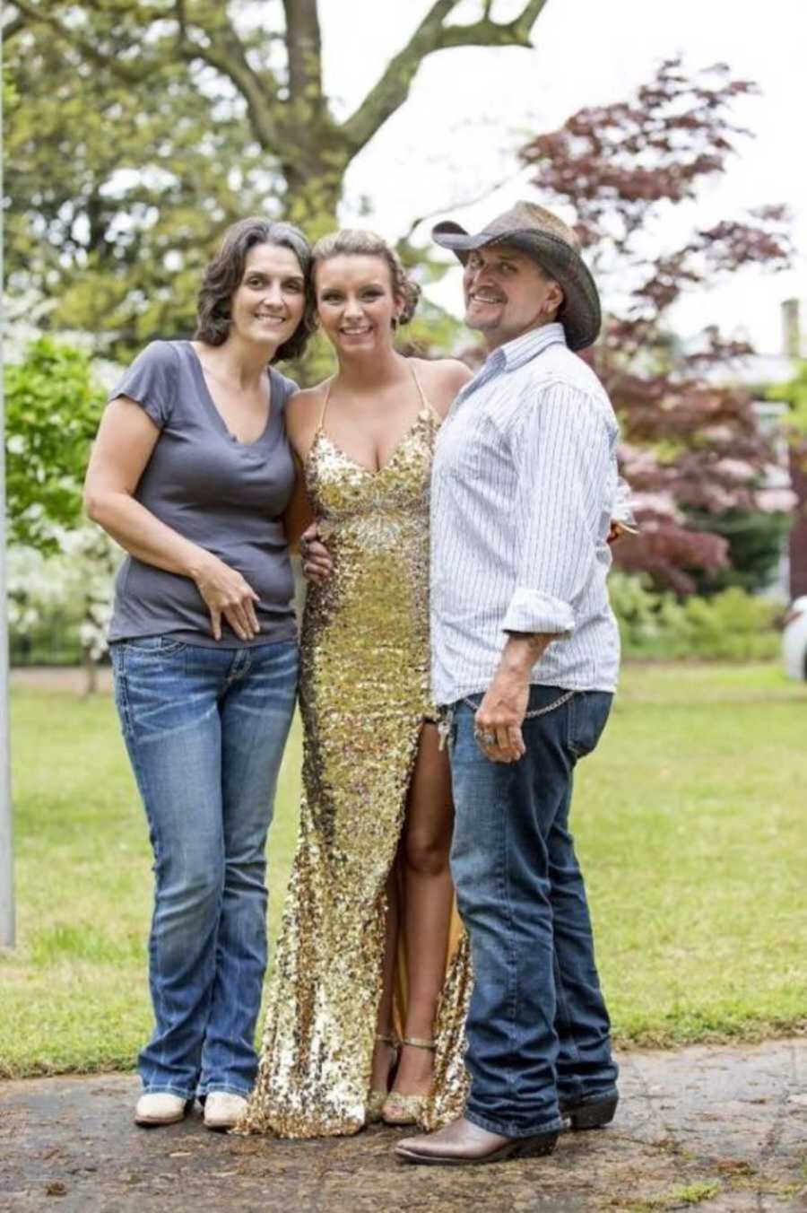 Pregnant teen wearing hold prom dress