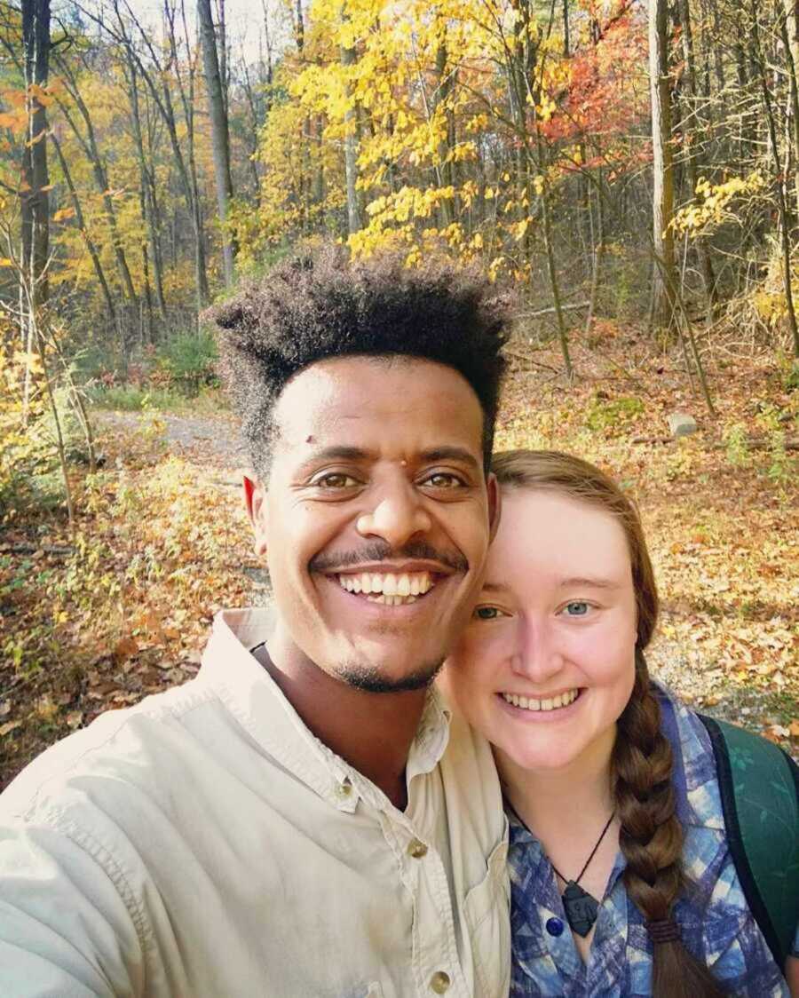 Joyous couple smiling outdoors in the Fall 