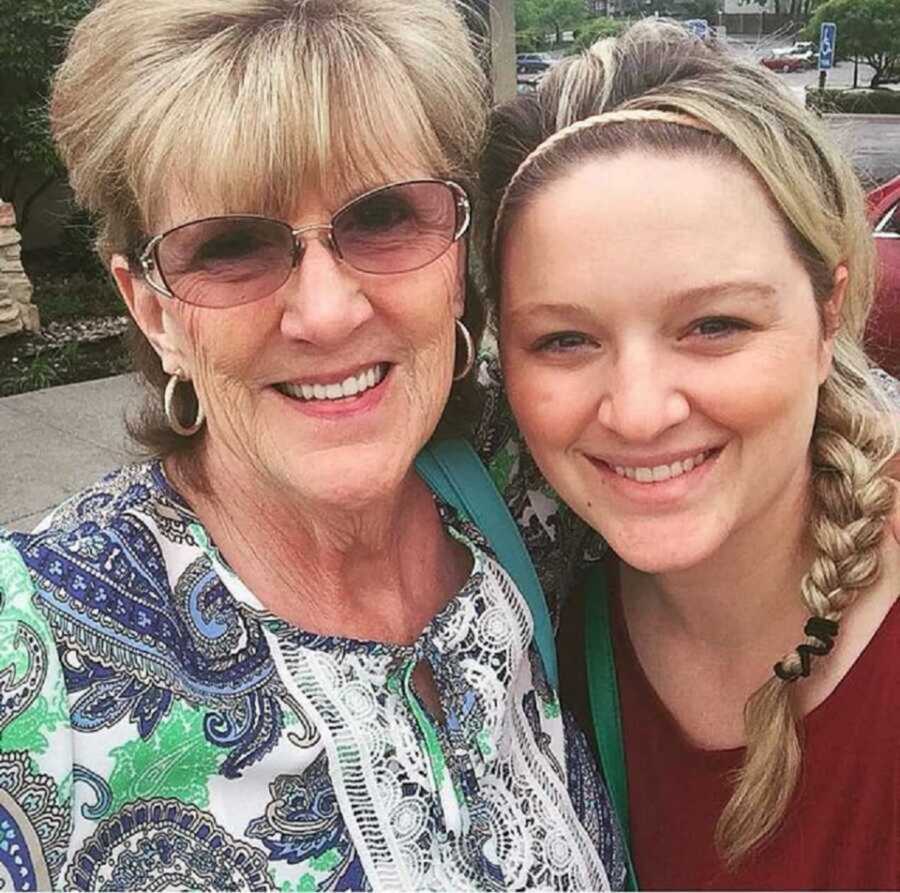 grandma and granddaughter smile in selfie