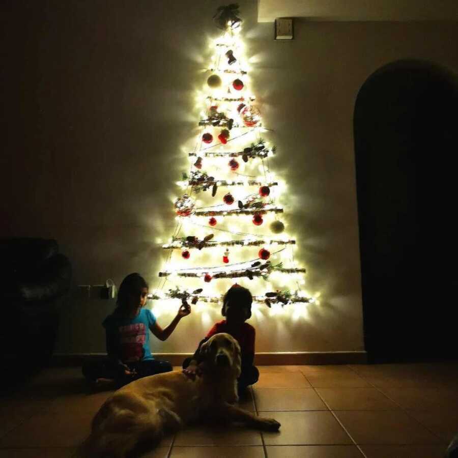 Christmas tree built on wall to keep animals away