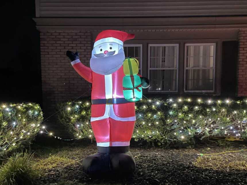 blow up Santa clause Christmas decoration placed in front yard