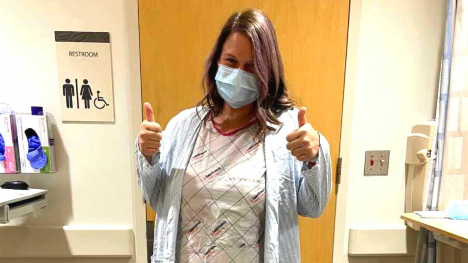 Patient with endometriosis giving thumbs up in doctor's office