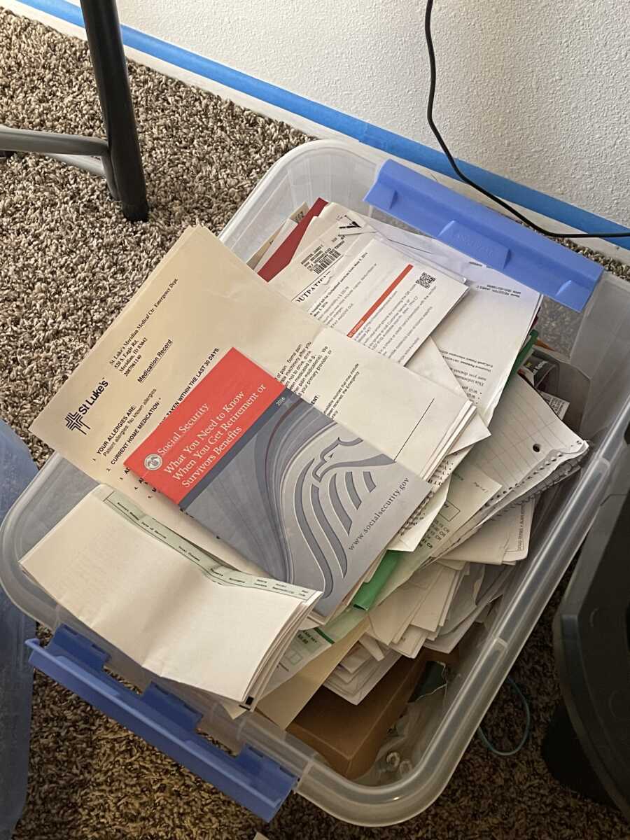 plastic bin full of hospital papers and receipts widowed wife collected after husbands passing