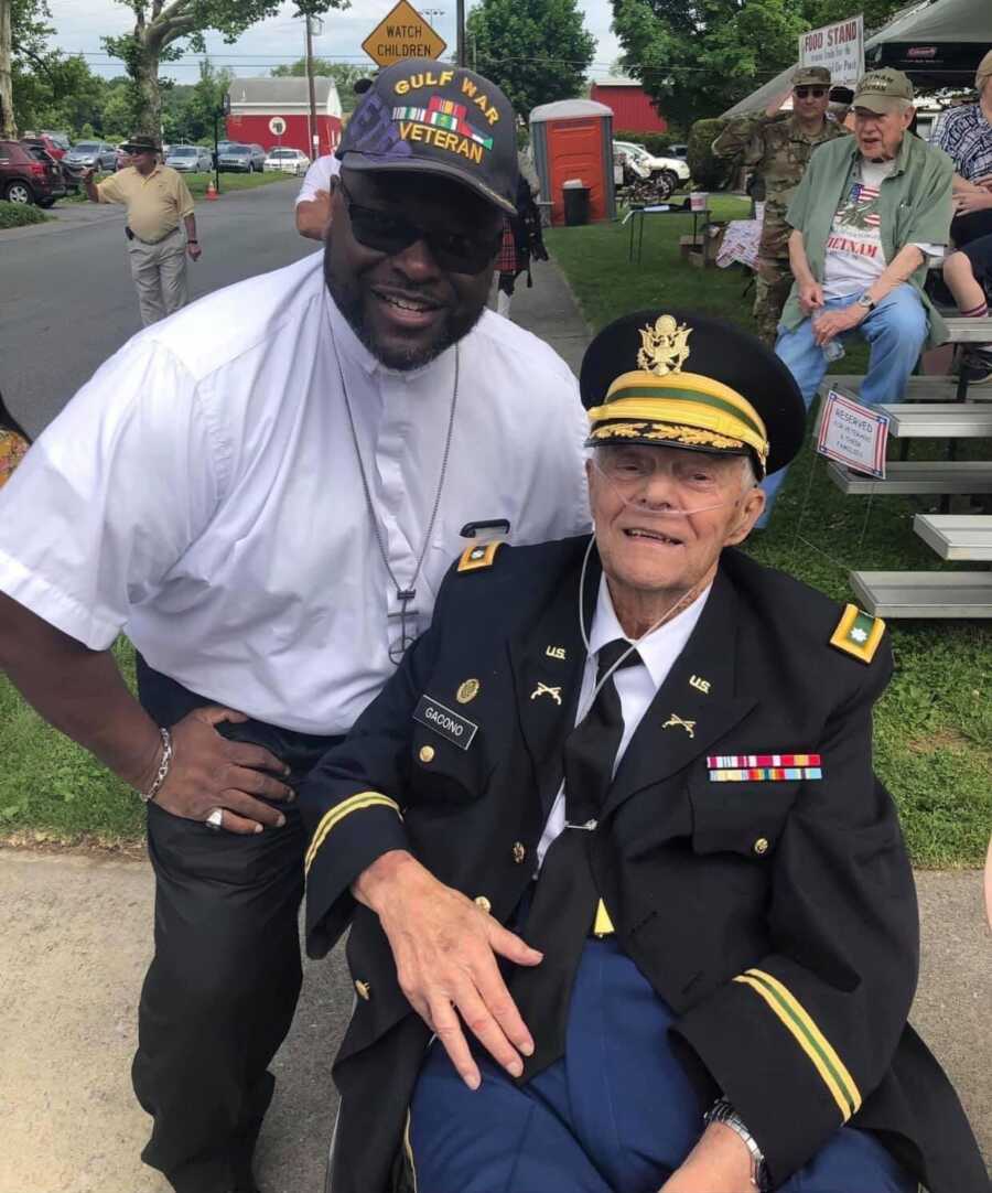 pastor and elderly army veteran at Memorial Day parade