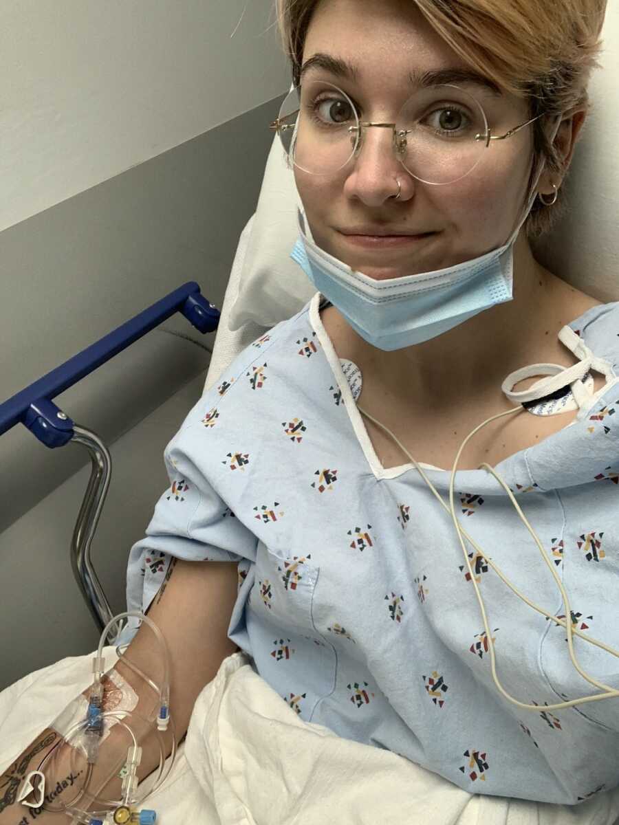 woman with Ehlers-Danlos syndrome sits in bed while in emergency room