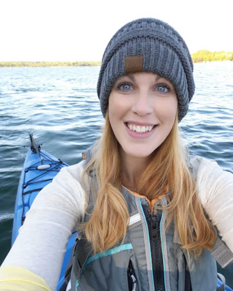 chronic illness warrior takes a selfie while kayaking in open water