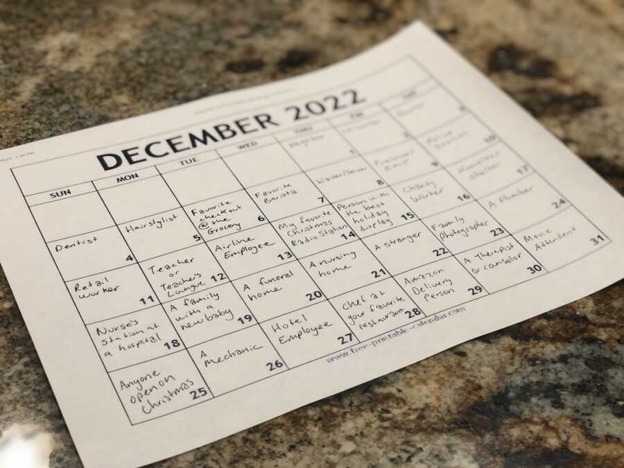 December 2022 calendar of acts of kindness with people written on each day