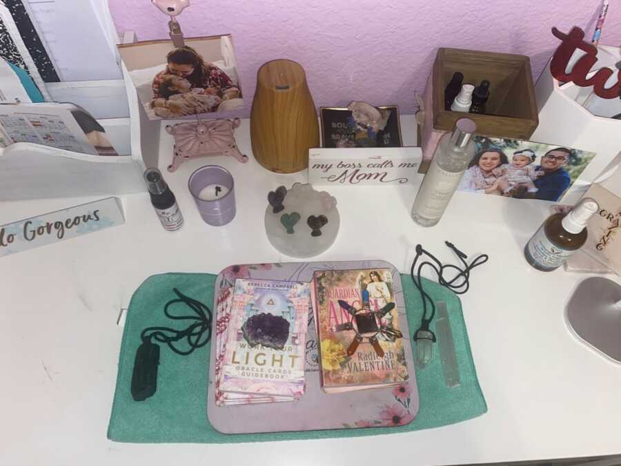 desk with spiritual guidance tools laid out on the surface